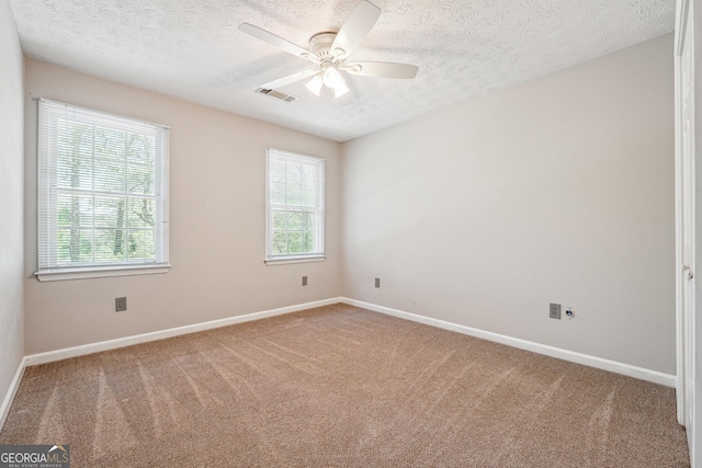 1366 Maple Ridge Dr, Suwanee, GA 30024 - unfurnished room with carpet floors, a ceiling fan, and a textured ceiling