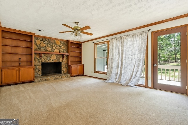 1366 Maple Ridge Dr, Suwanee, GA 30024 - unfurnished living room with crown molding, carpet flooring, a fireplace, baseboards, and a ceiling fan