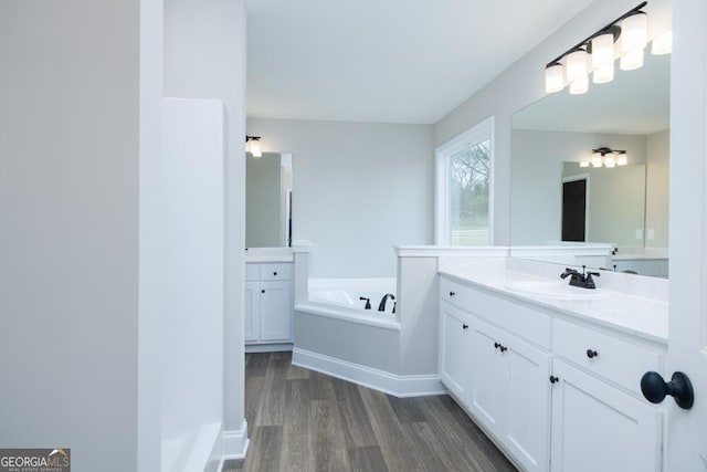280 Grady Brock Rd Lot 21, Martin, GA 30557 - bathroom with wood finished floors, two vanities, and a bath