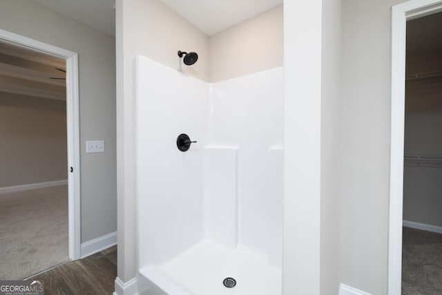 280 Grady Brock Rd Lot 21, Martin, GA 30557 - full bathroom with a shower stall, a walk in closet, and wood finished floors