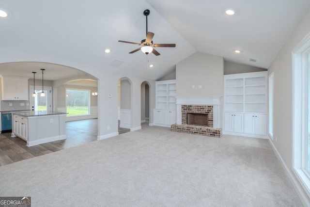 280 Grady Brock Rd Lot 21, Martin, GA 30557 - unfurnished living room with light colored carpet, arched walkways, built in features, lofted ceiling, and ceiling fan