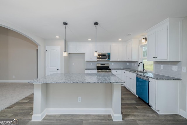 280 Grady Brock Rd Lot 21, Martin, GA 30557 - kitchen featuring stainless steel appliances, white cabinetry, light stone counters, tasteful backsplash, and a kitchen island