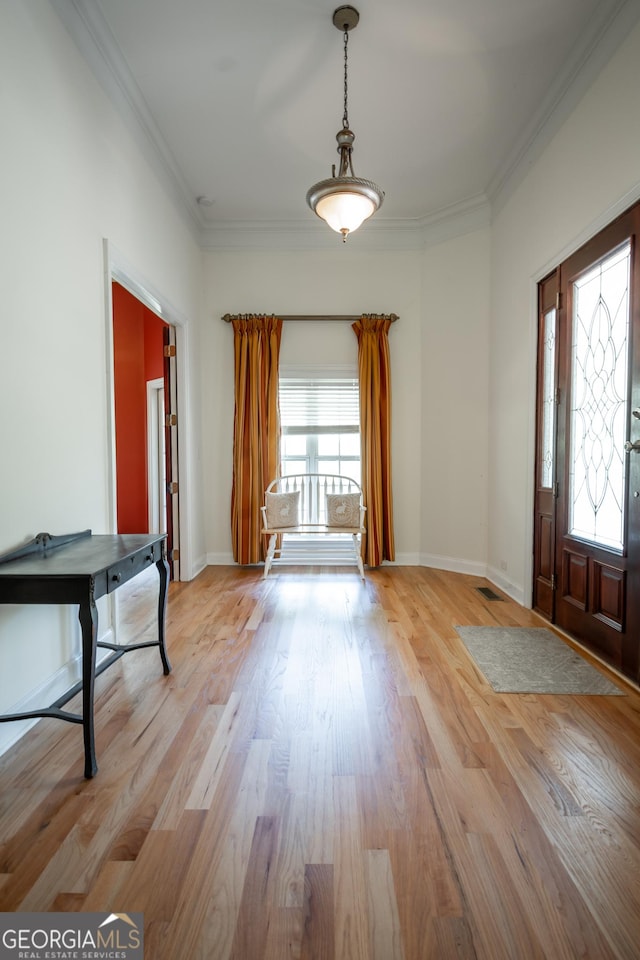 229 Deer Haven Run, Carlton, GA 30627 - foyer with baseboards, ornamental molding, light wood-type flooring, and visible vents