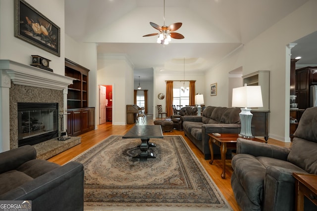229 Deer Haven Run, Carlton, GA 30627 - living area featuring ornamental molding, a fireplace, a ceiling fan, and light wood finished floors