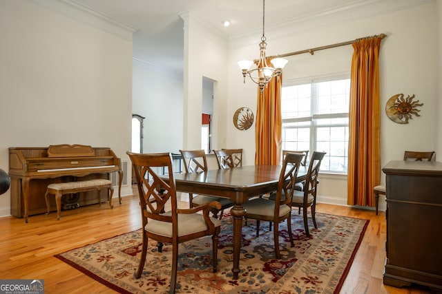 229 Deer Haven Run, Carlton, GA 30627 - dining area with crown molding, baseboards, a notable chandelier, and light wood-type flooring