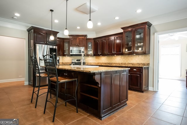 229 Deer Haven Run, Carlton, GA 30627 - kitchen featuring crown molding, appliances with stainless steel finishes, tasteful backsplash, and dark brown cabinets