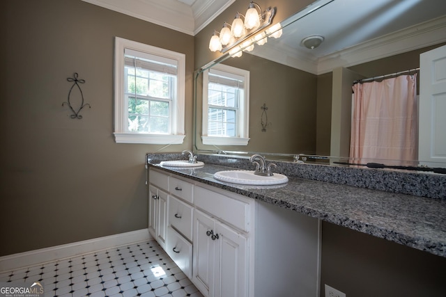 229 Deer Haven Run, Carlton, GA 30627 - bathroom with a sink, baseboards, ornamental molding, and double vanity