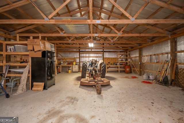 229 Deer Haven Run, Carlton, GA 30627 - misc room with concrete flooring, vaulted ceiling, and a garage