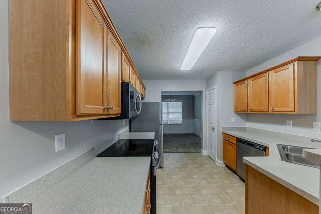 kitchen with a textured ceiling, electric range oven, stainless steel dishwasher, a sink, and light countertops