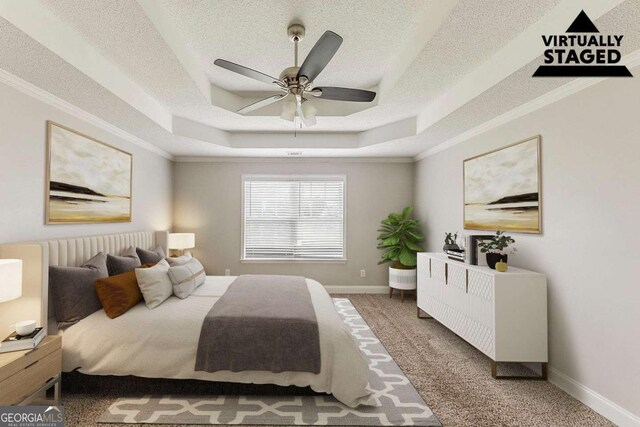 bedroom featuring baseboards, a raised ceiling, a textured ceiling, and carpet flooring