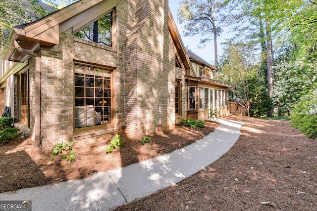 375 Spindle Ct, Sandy Springs, GA 30350 - view of property exterior with brick siding and a chimney