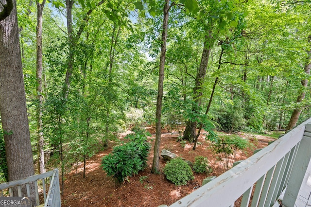view of yard with a view of trees