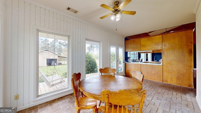1717 Grady Saunders Rd, Portal, GA 30450 - dining room featuring visible vents, brick floor, a wealth of natural light, and ceiling fan