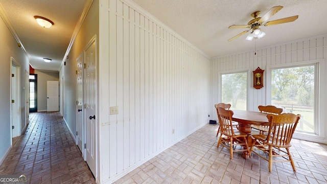 1717 Grady Saunders Rd, Portal, GA 30450 - dining room featuring a ceiling fan, ornamental molding, a textured ceiling, and brick floor