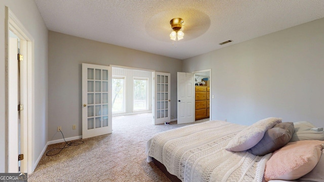 1717 Grady Saunders Rd, Portal, GA 30450 - carpeted bedroom with baseboards, a ceiling fan, a textured ceiling, and visible vents