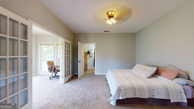 1717 Grady Saunders Rd, Portal, GA 30450 - carpeted bedroom with visible vents, baseboards, a textured ceiling, french doors, and a ceiling fan