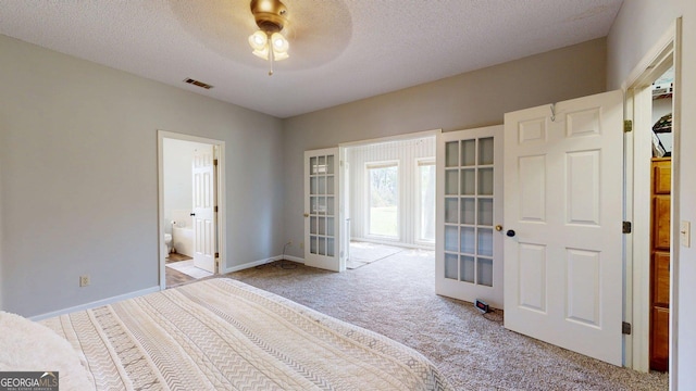1717 Grady Saunders Rd, Portal, GA 30450 - unfurnished bedroom with a textured ceiling, visible vents, light carpet, and french doors