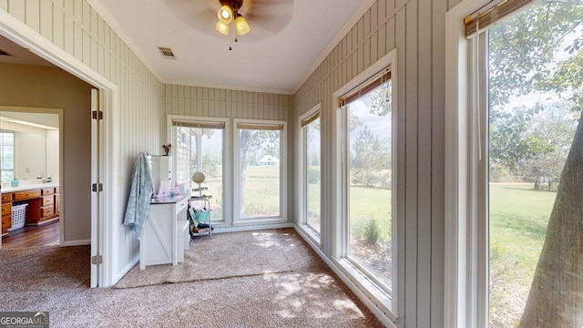 1717 Grady Saunders Rd, Portal, GA 30450 - unfurnished sunroom with carpet floors, visible vents, ornamental molding, and a wealth of natural light