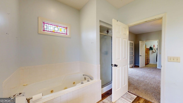1717 Grady Saunders Rd, Portal, GA 30450 - full bath featuring a tub with jets, baseboards, and a stall shower