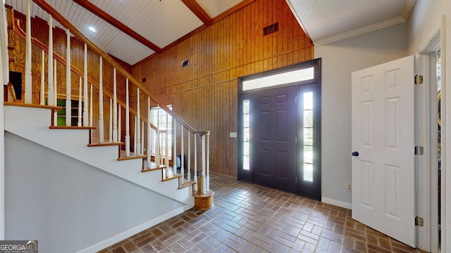 1717 Grady Saunders Rd, Portal, GA 30450 - entrance foyer featuring brick floor, wood walls, stairs, baseboards, and visible vents