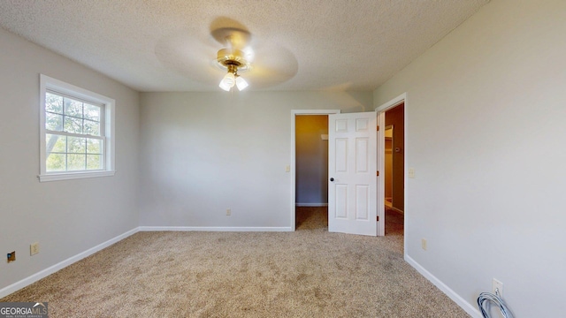 1717 Grady Saunders Rd, Portal, GA 30450 - unfurnished bedroom featuring carpet floors, a ceiling fan, a textured ceiling, and baseboards