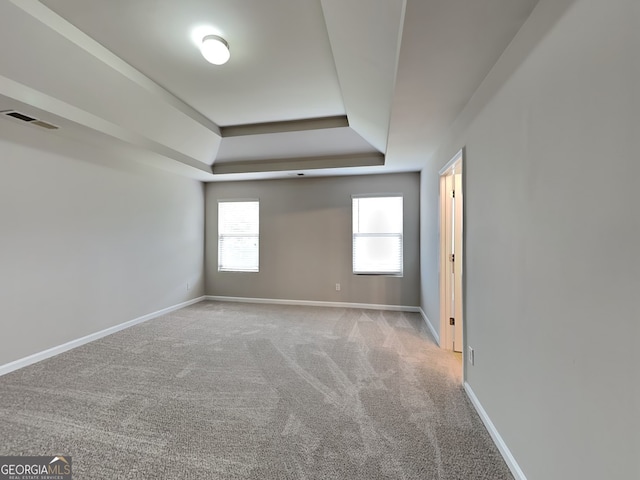 1392 Worcester Trl, Mcdonough, GA 30253 - carpeted empty room featuring a tray ceiling and baseboards