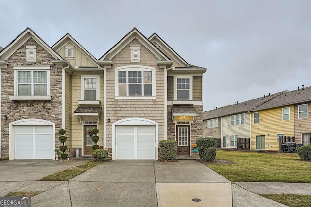 1963 Lakeshore Overlook Cir NW, Kennesaw, GA 30152 - view of property featuring a garage, a front yard, stone siding, and concrete driveway