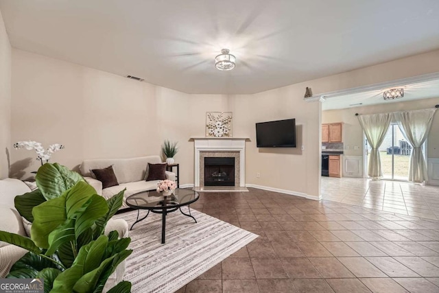 1963 Lakeshore Overlook Cir NW, Kennesaw, GA 30152 - tiled living room with visible vents, baseboards, and a tiled fireplace