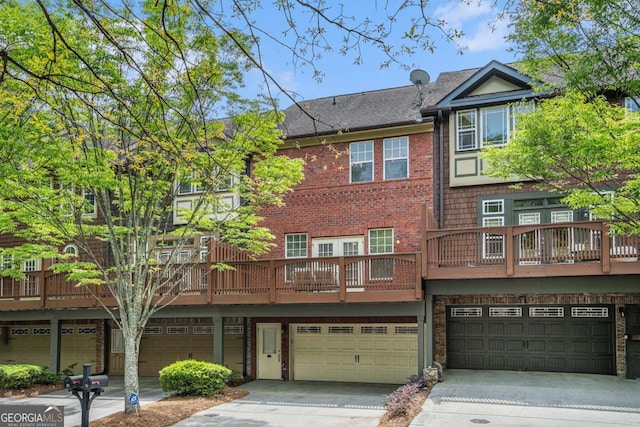 75 High Top Ln, Sandy Springs, GA 30328 - rear view of house with a garage, driveway, a shingled roof, and brick siding