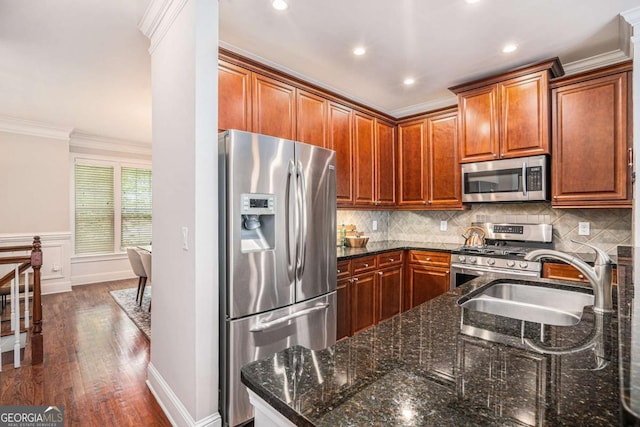 75 High Top Ln, Sandy Springs, GA 30328 - kitchen with stainless steel appliances, crown molding, dark wood-style floors, dark stone counters, and recessed lighting