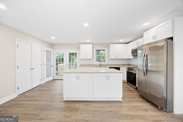 2805 Long Way, Decatur, GA 30032 - kitchen featuring appliances with stainless steel finishes, a sink, white cabinets, a center island, and recessed lighting