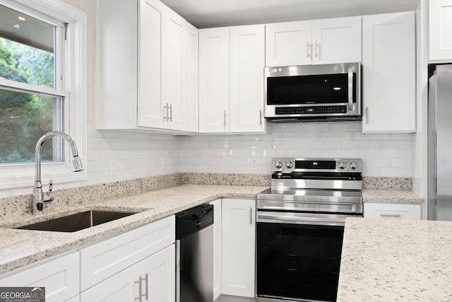 2805 Long Way, Decatur, GA 30032 - kitchen featuring appliances with stainless steel finishes, a sink, and white cabinetry