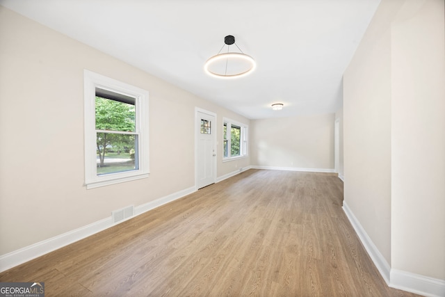 2805 Long Way, Decatur, GA 30032 - unfurnished living room featuring light wood-type flooring and baseboards