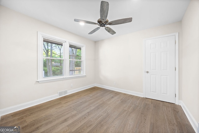 2805 Long Way, Decatur, GA 30032 - unfurnished room featuring wood finished floors, ceiling fan, and baseboards
