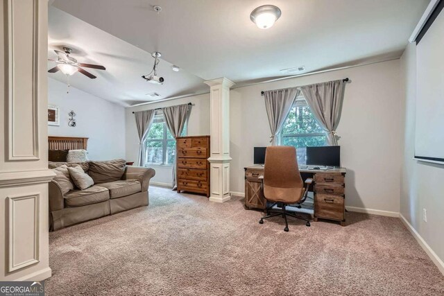 home office with light carpet, ornate columns, and a wealth of natural light