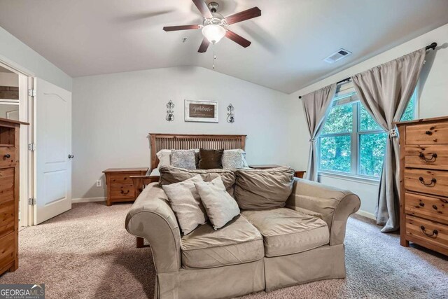bedroom with carpet flooring, a ceiling fan, baseboards, vaulted ceiling, and visible vents