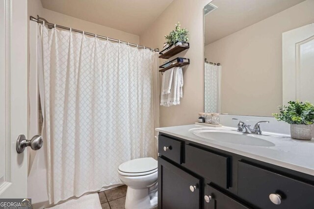 full bath featuring vanity, toilet, tile patterned floors, a shower with shower curtain, and visible vents