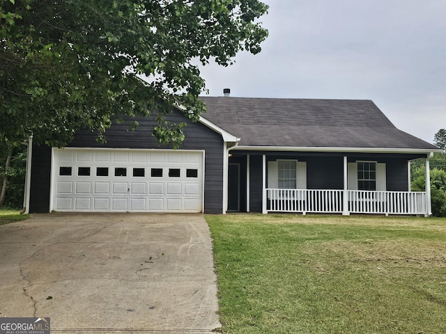 ranch-style house with covered porch, an attached garage, driveway, and a front yard