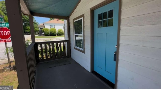 50 Ivy St, Porterdale, GA 30014 - property entrance with a porch