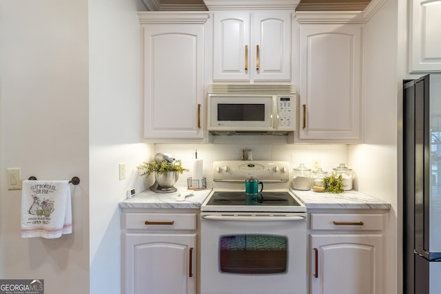 51 Montview Ct, Ringgold, GA 30736 - kitchen with decorative backsplash, white cabinetry, and white appliances