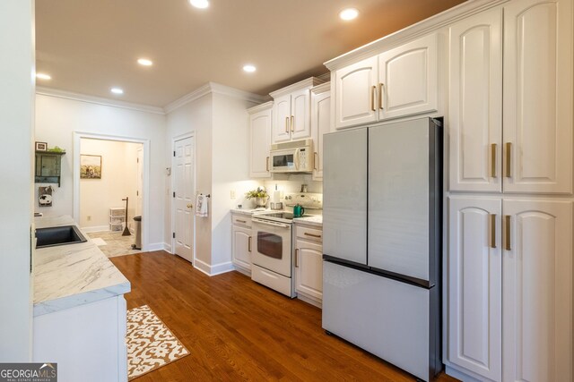 51 Montview Ct, Ringgold, GA 30736 - kitchen featuring ornamental molding, dark wood-style flooring, white appliances, recessed lighting, and white cabinetry