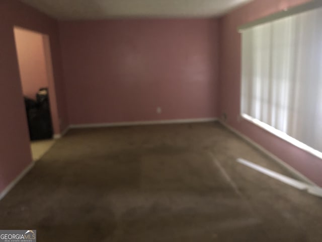 2017 Pine Cone Dr SW, Atlanta, GA 30331 - unfurnished room featuring baseboards and carpet