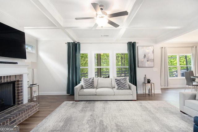 living area with coffered ceiling, baseboards, a ceiling fan, and wood finished floors