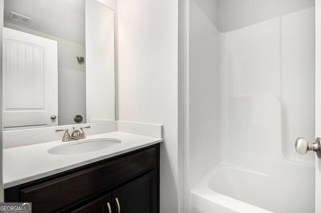 full bath with visible vents and vanity