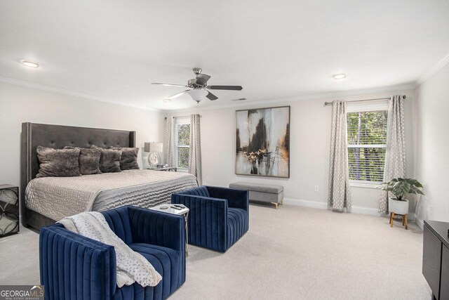 bedroom with multiple windows, ornamental molding, and light colored carpet