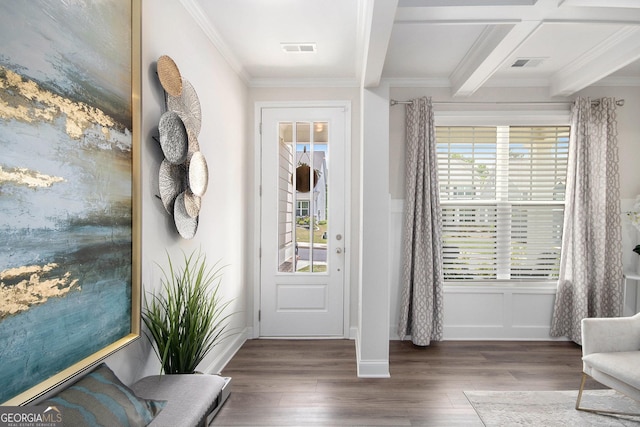 foyer featuring plenty of natural light, wood finished floors, and visible vents