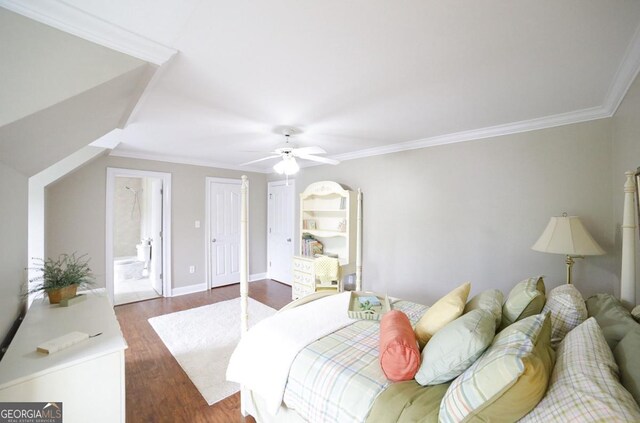 bedroom featuring crown molding, a ceiling fan, dark wood finished floors, and baseboards