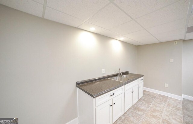 laundry room featuring recessed lighting, baseboards, and a sink