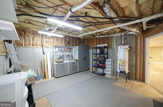 unfinished below grade area featuring water heater