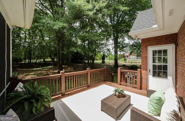 deck featuring outdoor lounge area